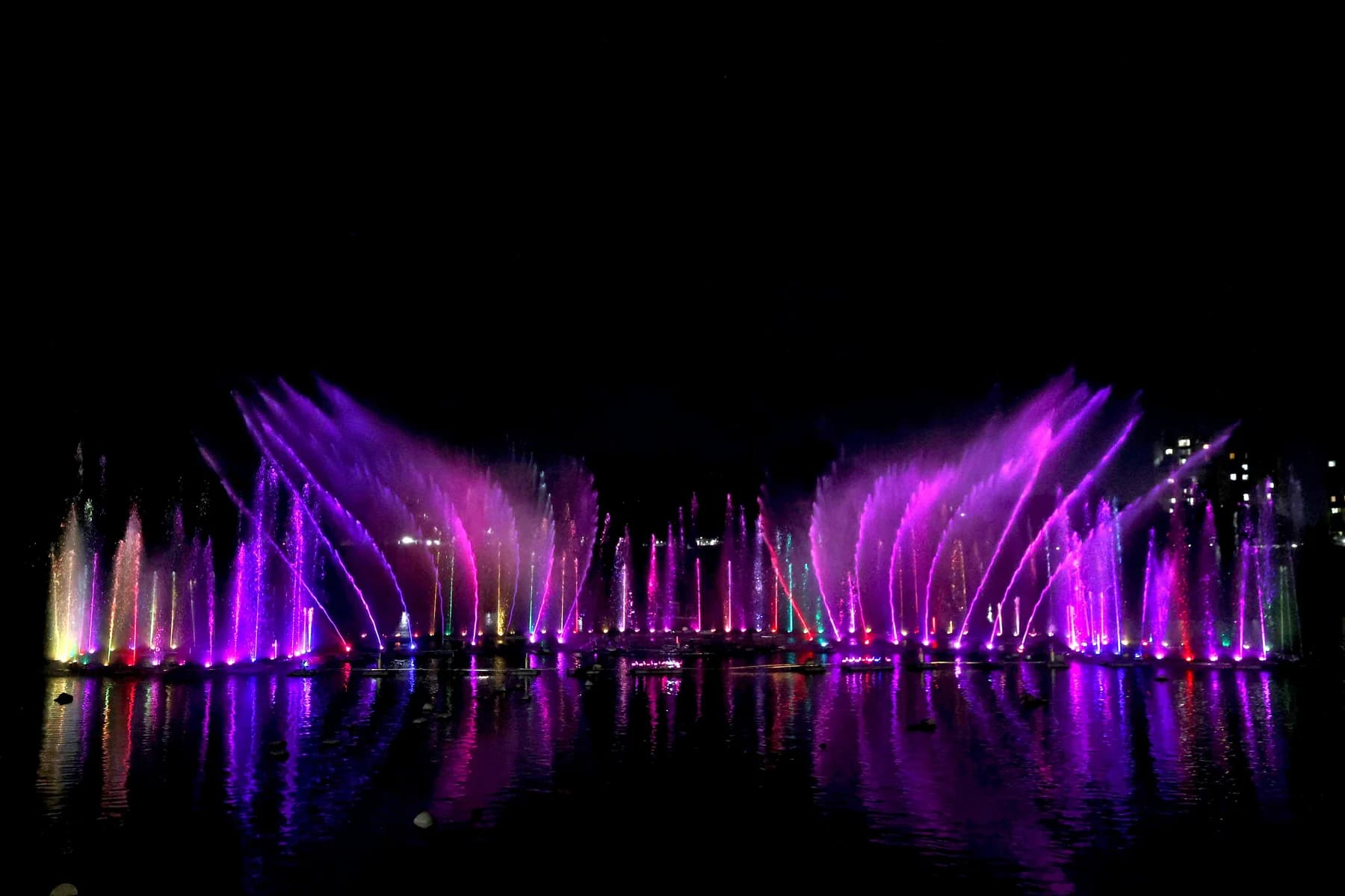 Violet fountain fans across the full span of Upper Lake, Bhopal